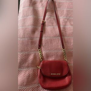 Michael Kors red leather crossbody purse.